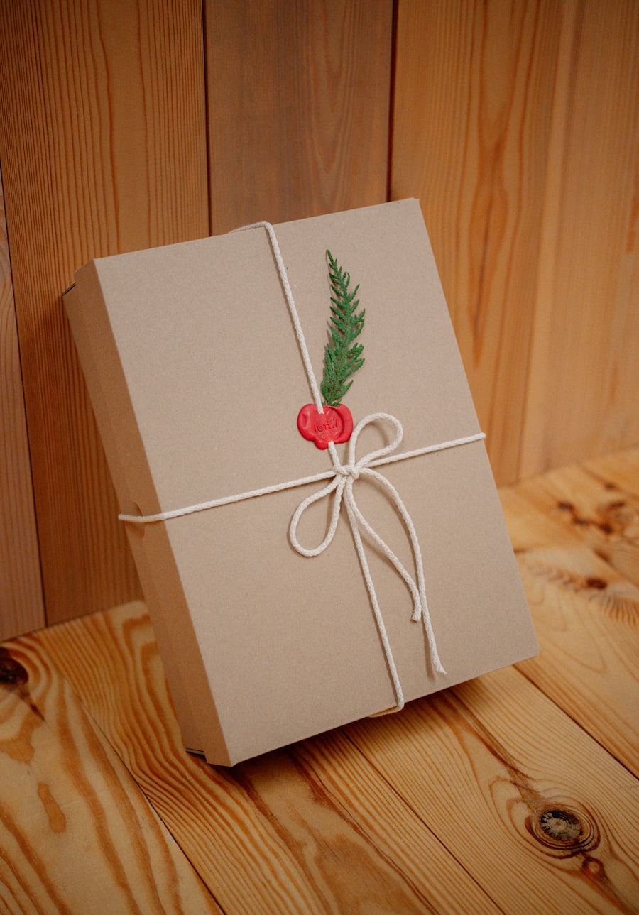 A brown kraft-paper parcel tied with linen twine and a sprig of greenery